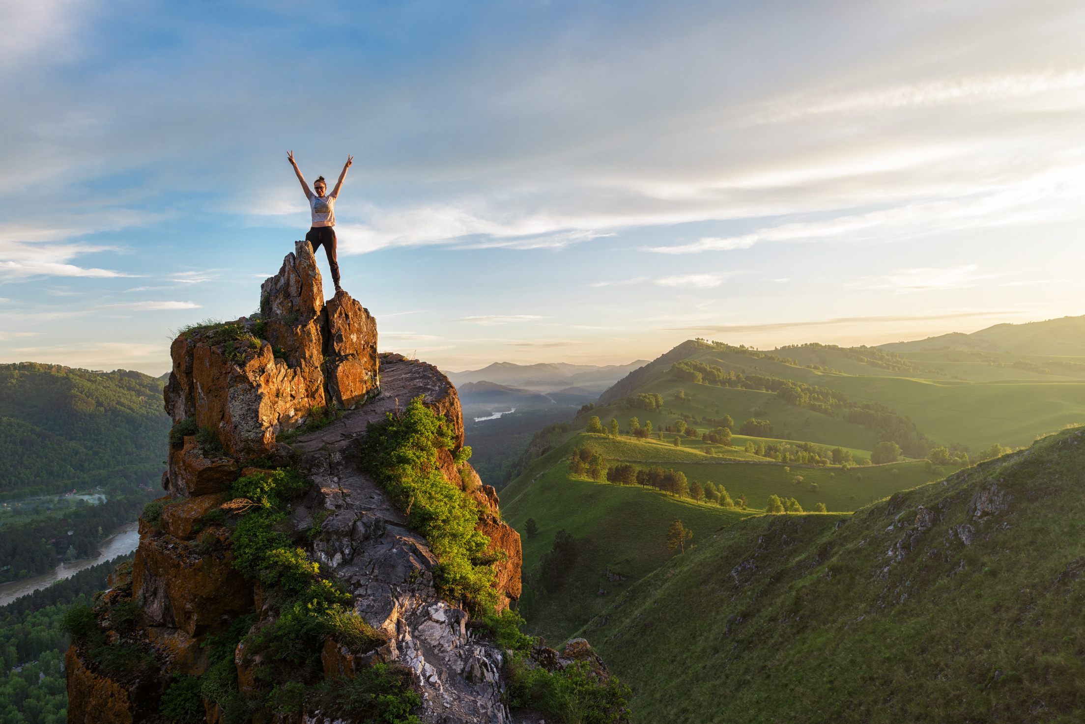 Woman on top mountain in Altai